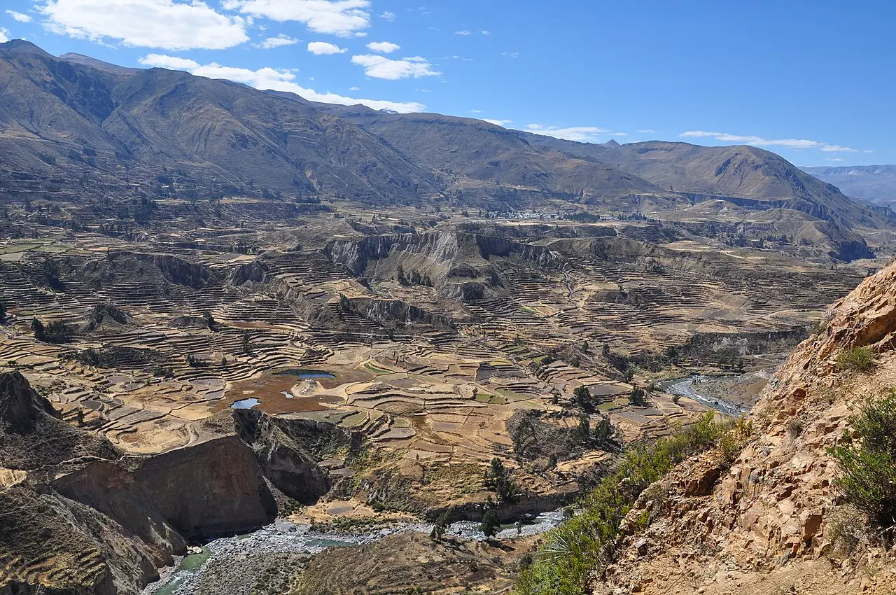 Sunlit terraces and river in Colca Canyon